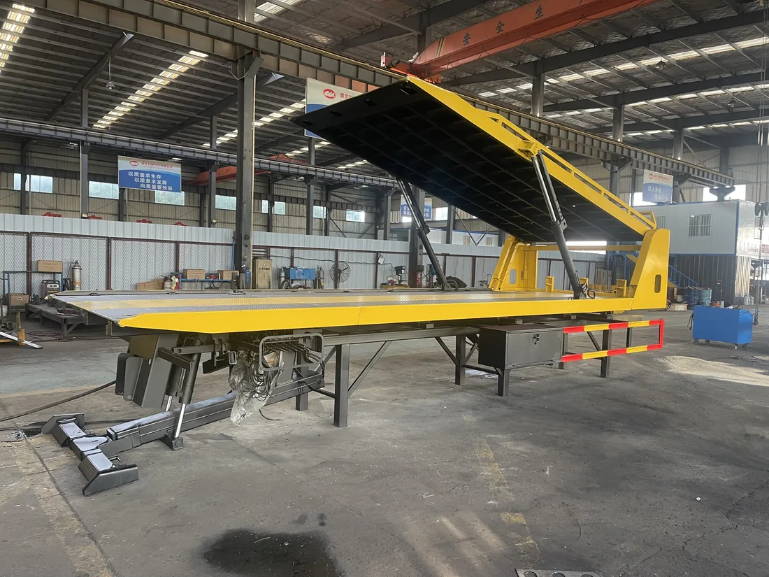 Double-deck flatbed carrier with upper deck raised