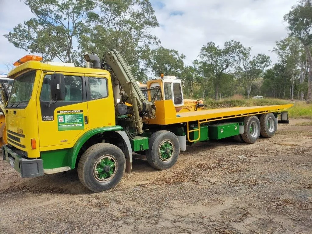 USA-style flatbed carrier tow truck